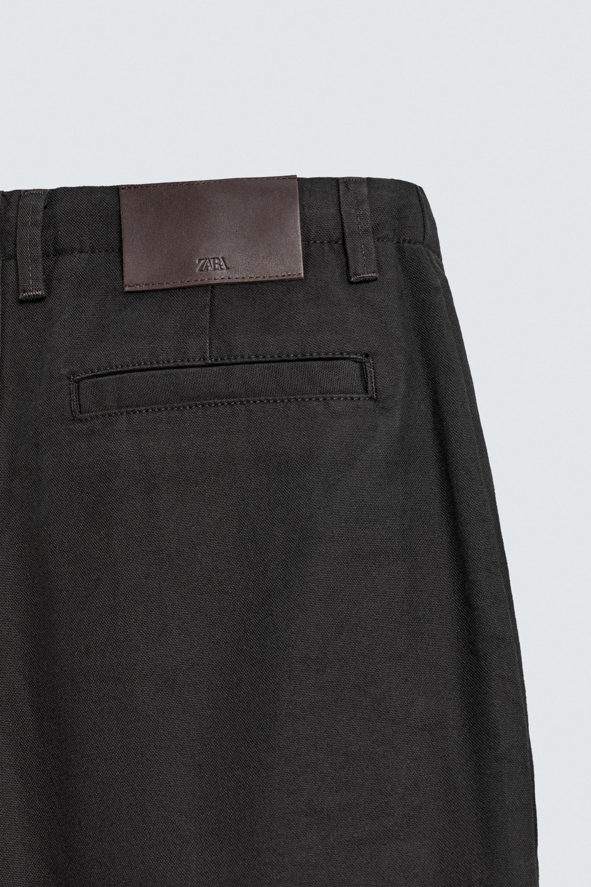 WIDE FIT PLEATED PANTS